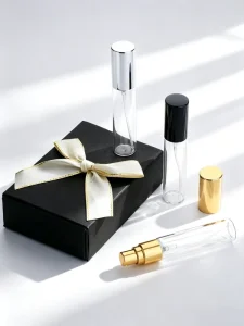 Custom Logo Screen Printed Black Cylinder Gift Box with Bow for Perfume Cosmetics Essential Oil Packaging